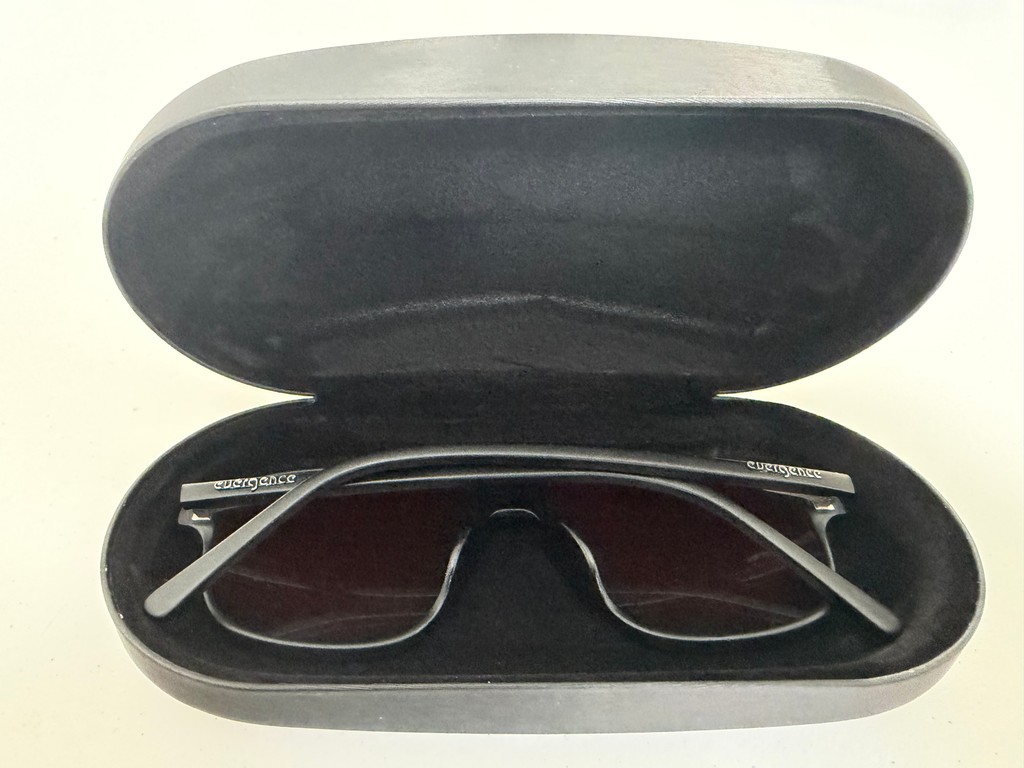 Second view of the opened Jetpack Case holding glasses with darker red lenses
